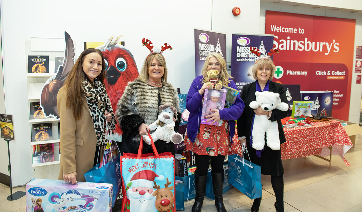 Ladies holding donated gifts at Meridian Waterside Southampton 